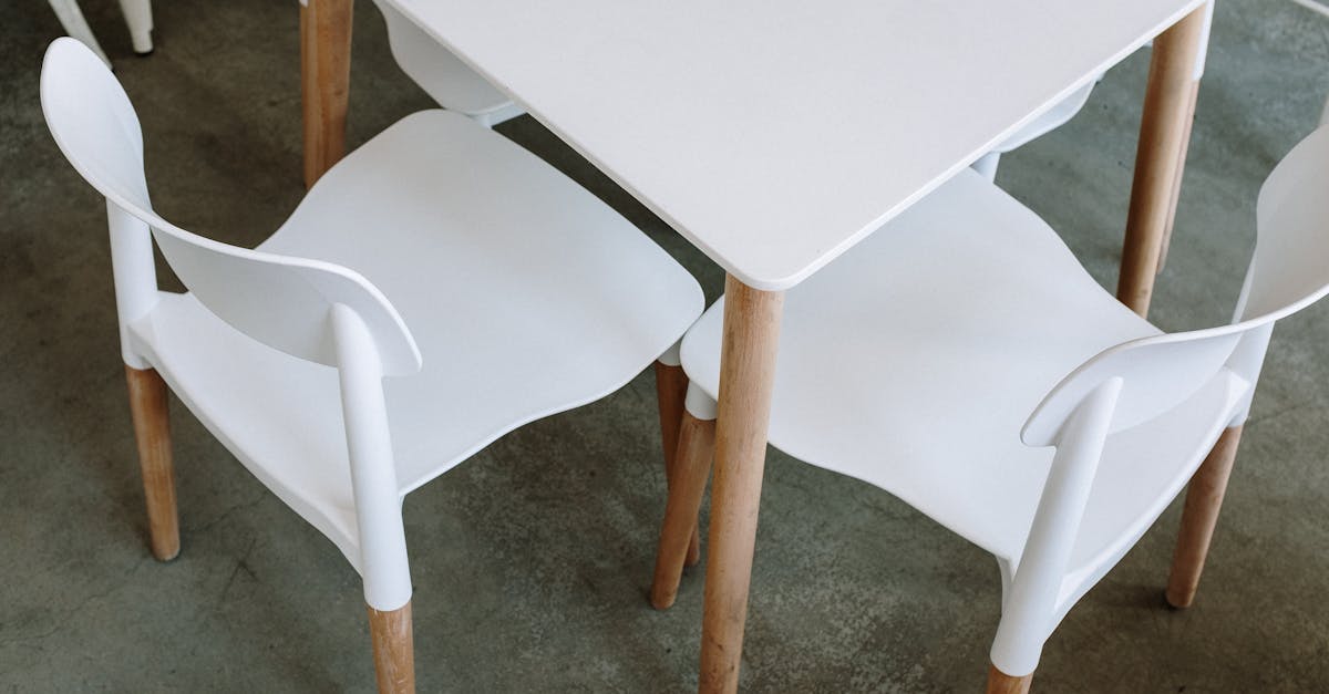 top view of a modern minimalist white table and chairs in a cafe setting