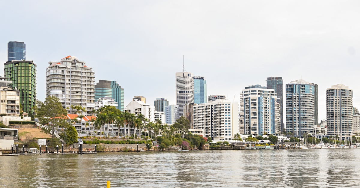 panoramic view of brisbane skyline with modern skyscrapers from riverfront perspective